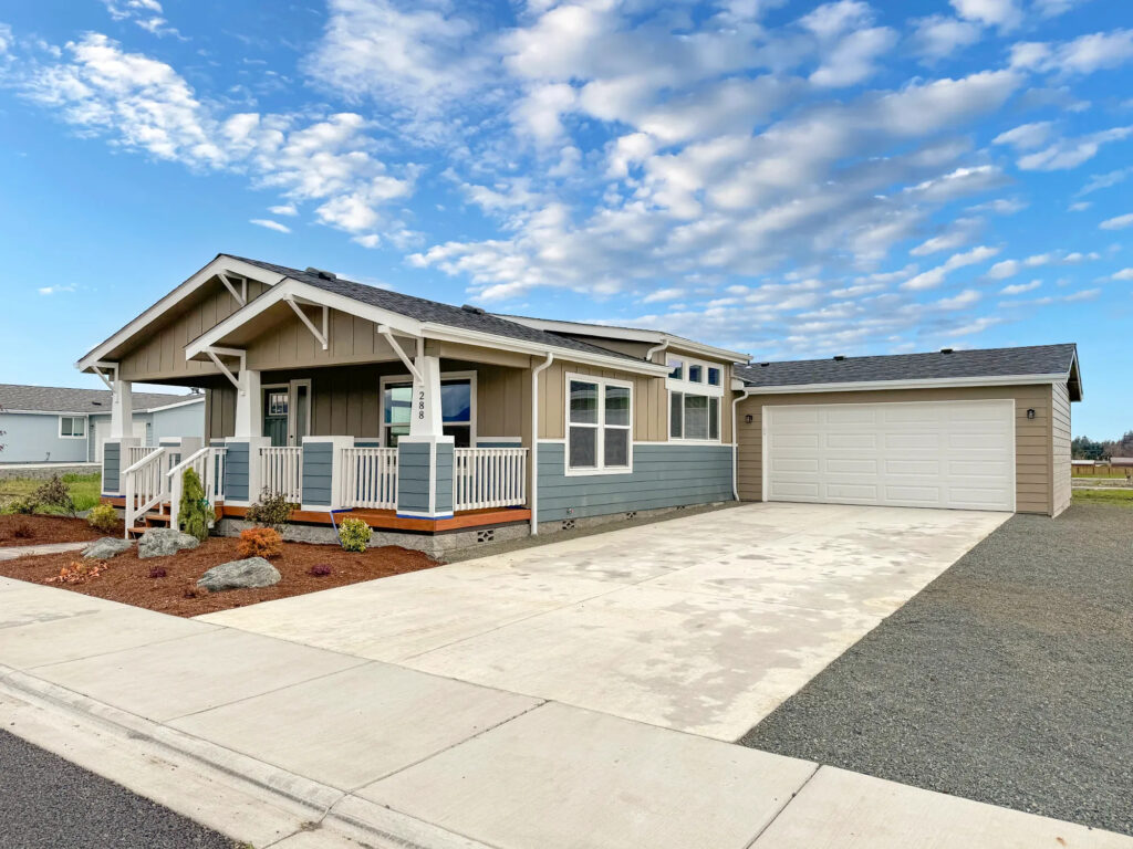 Manufactured home with a garage on property