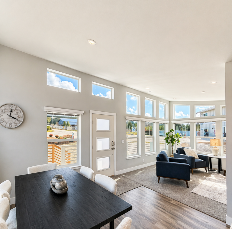 Bright dining and living area inside a manufactured home