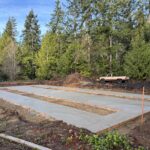 Manufactured home services site development. Shown as a concrete foundation