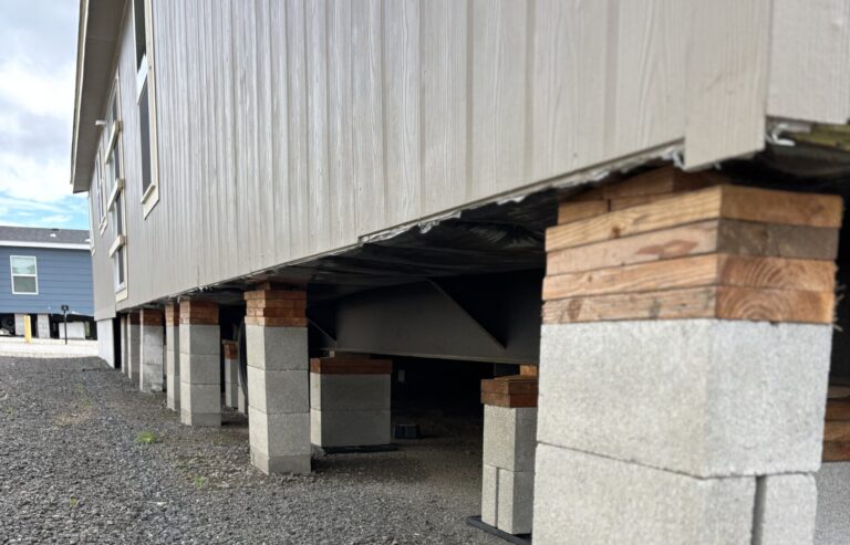 Manufactured home supported on leveled piers