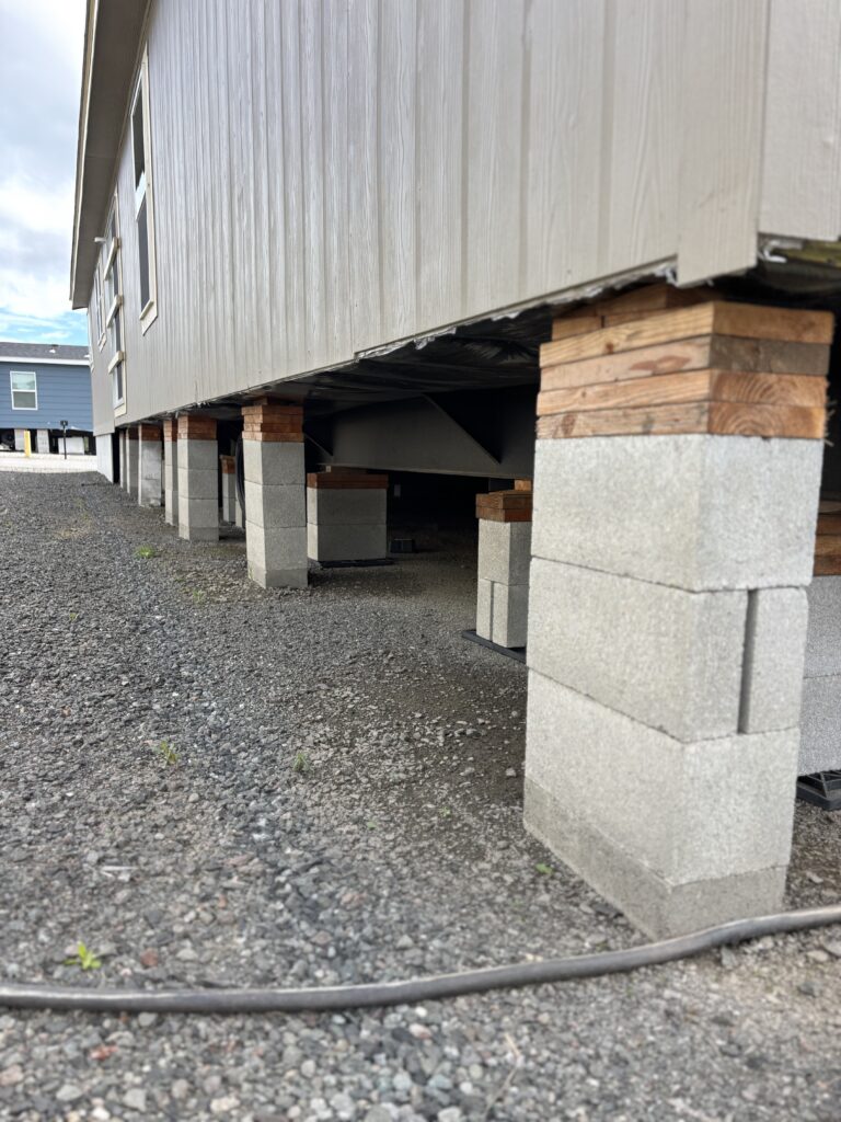 Supports and piers underneath a manufactured home