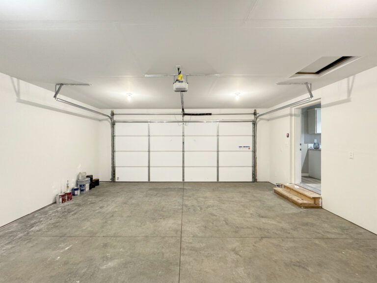 Finished two-car garage interior with an automatic garage door opener