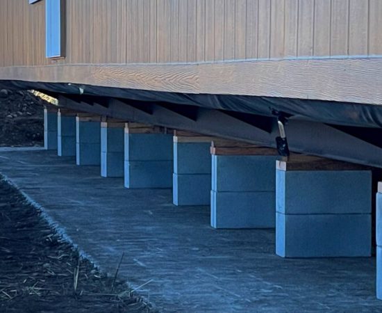 Manufactured Home on Blocks being professionally set and leveled